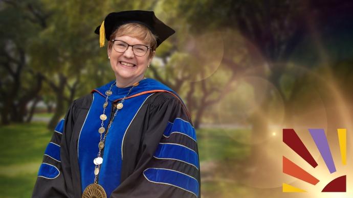 President Vanessa B. Beasley in her full regalia smiles outside